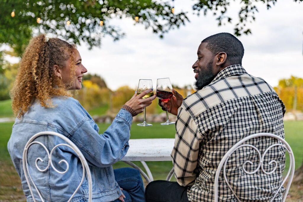 A couple toasting wine at Prairie Moon Winery.