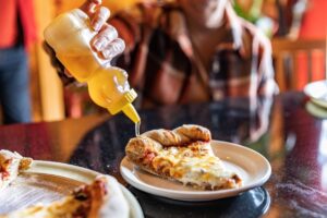 A drizzle of honey on the crust at Great Plains Sauce and Dough Co. in Ames, Iowa.