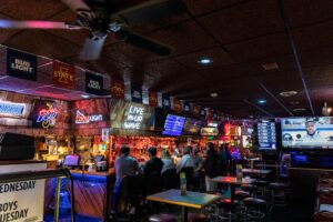 patrons at bar at Welch Ave. Station in Ames