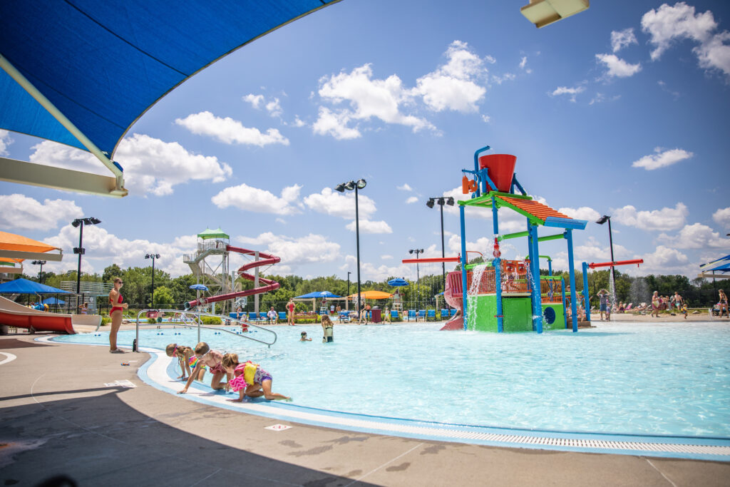 Family cooling down in pool at Ames Furman Aquatic Center.